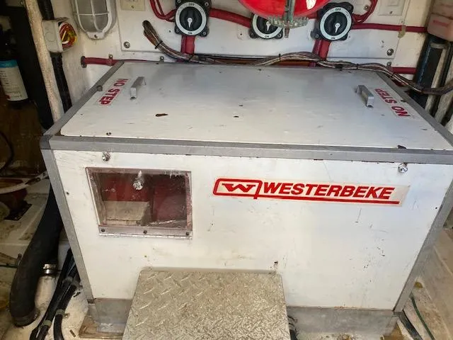 Slide: The Image of Westerbeke generator in the engine room of a 2000 Cabo 35 Express boat. - 46