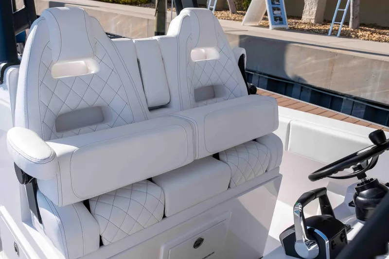 Slide: The Image of Luxurious white seating on 2026 Reef Runner 340 boat, featuring diamond stitching and modern design. - 12