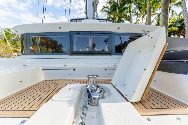 Slide: The Image of 2024 Lagoon 51 yacht deck with teak flooring and modern design. - 13
