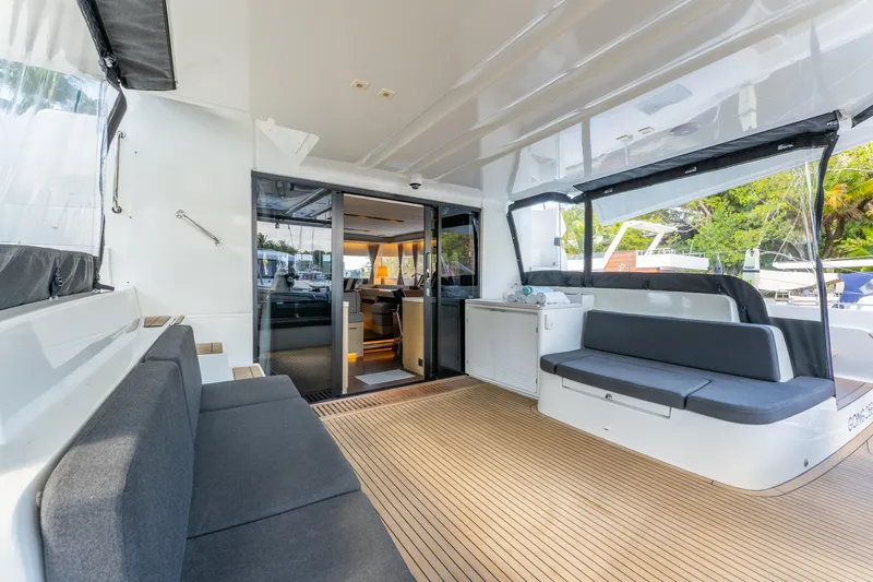 Slide: The Image of 2024 Lagoon 51 yacht interior with sleek seating and modern design. - 22