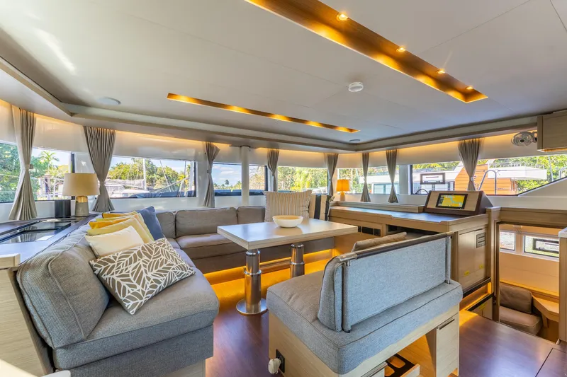 Slide: The Image of Luxurious interior of 2024 Lagoon 51 yacht with modern furnishings and panoramic windows. - 36