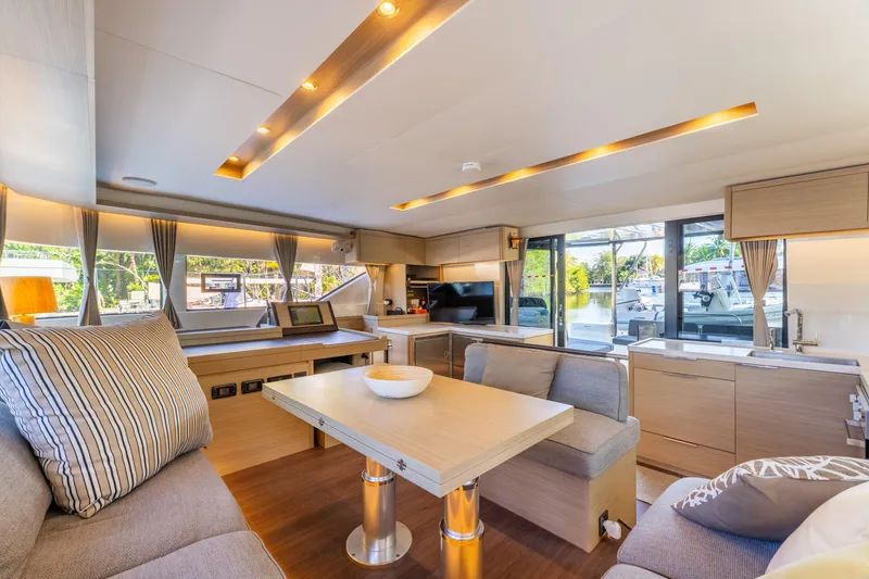 Slide: The Image of Luxurious interior of 2024 Lagoon 51 yacht with modern furnishings and ample natural light. - 37
