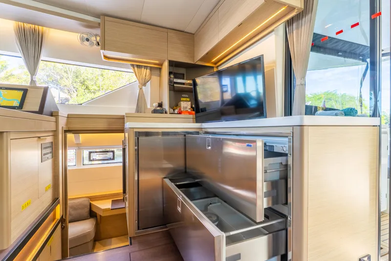 Slide: The Image of Luxurious interior of 2024 Lagoon 51 yacht with modern kitchen and entertainment area. - 44