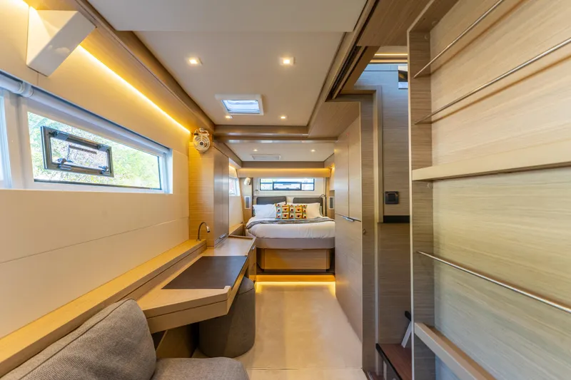 Slide: The Image of Luxurious interior of 2024 Lagoon 51 yacht with modern design and cozy bedroom. - 49