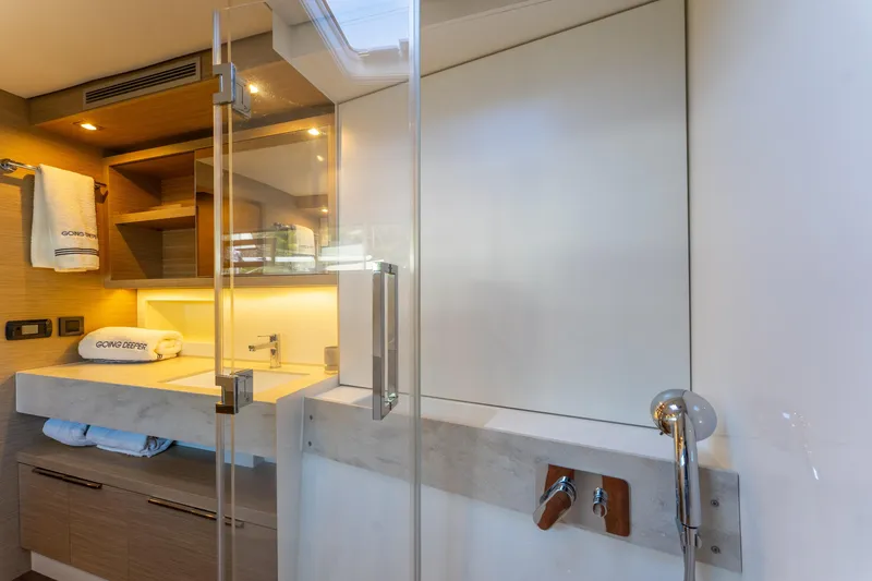 Slide: The Image of Luxurious bathroom interior of 2024 Lagoon 51 yacht with modern fixtures and elegant design. - 58