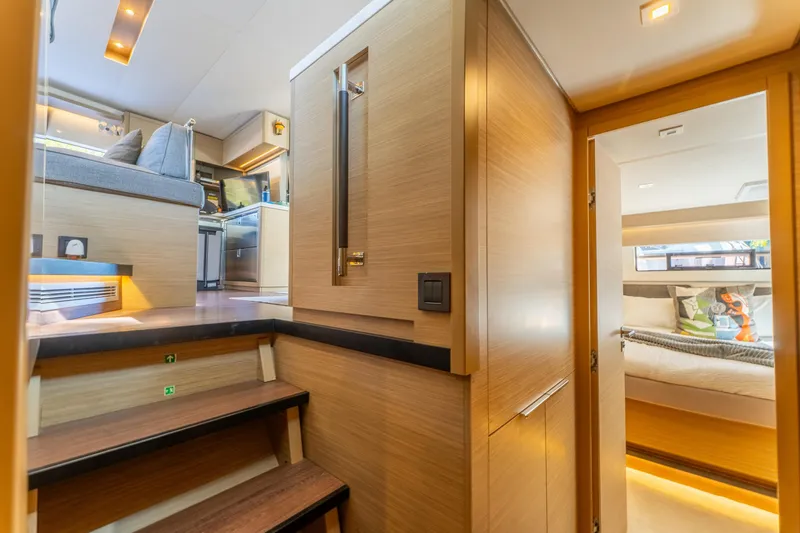 Slide: The Image of Luxurious interior of 2024 Lagoon 51 yacht featuring modern design and cozy cabin. - 62