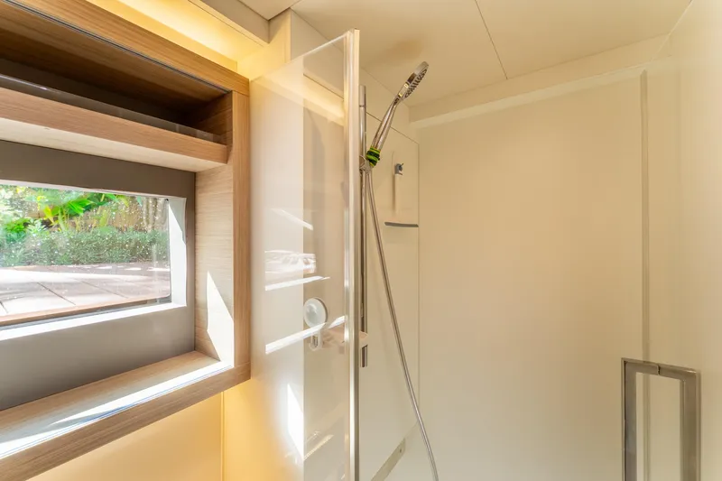Slide: The Image of Modern shower area in 2024 Lagoon 51 yacht, featuring sleek design and natural light. - 66