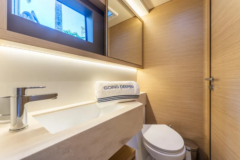 Slide: The Image of Luxurious bathroom in 2024 Lagoon 51 yacht with modern fixtures and elegant design. - 68