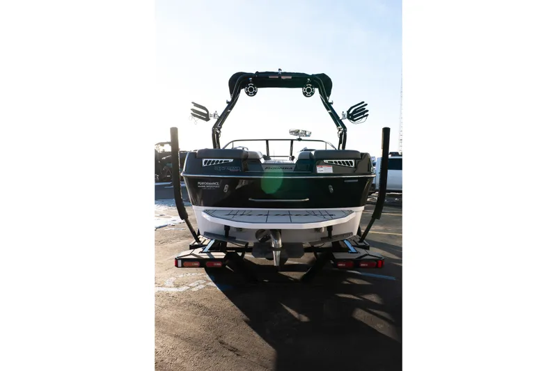 Slide: The Image of 2021 Moomba Mondo boat rear view with wakeboard tower and trailer. - 4