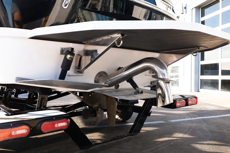 Slide: The Image of Rear view of 2021 Moomba Mondo boat on trailer, showcasing propeller and exhaust system. - 6