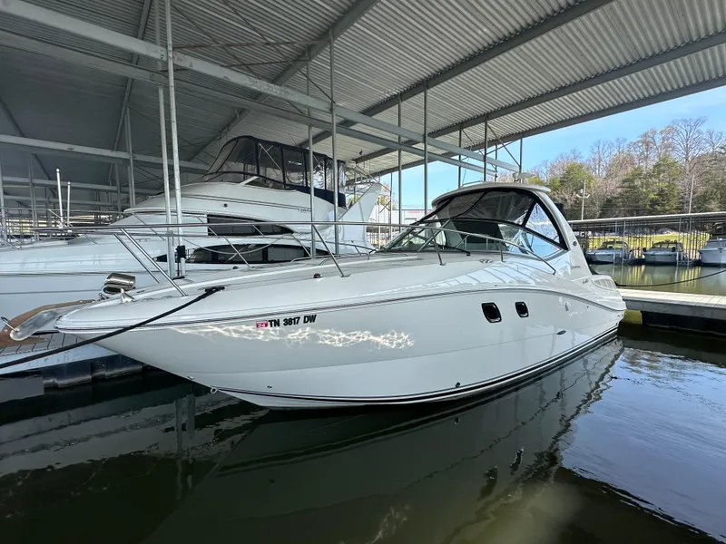 The Image of 2008 Sea Ray Sundancer 310 in a covered marina. - 0