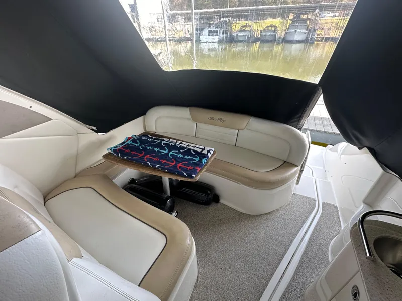 Slide: The Image of Interior of a 2008 Sea Ray Sundancer 310 with seating area. - 11