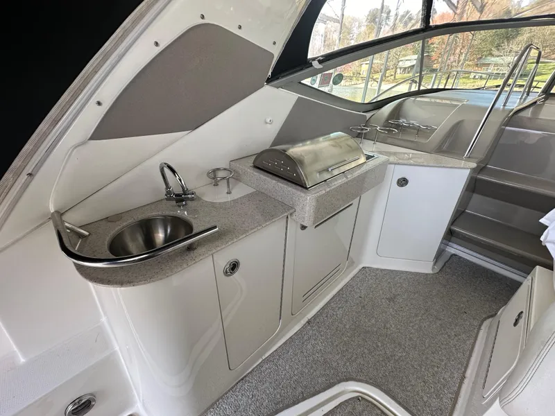 Slide: The Image of 2008 Sea Ray Sundancer 310 yacht interior with kitchenette. - 14