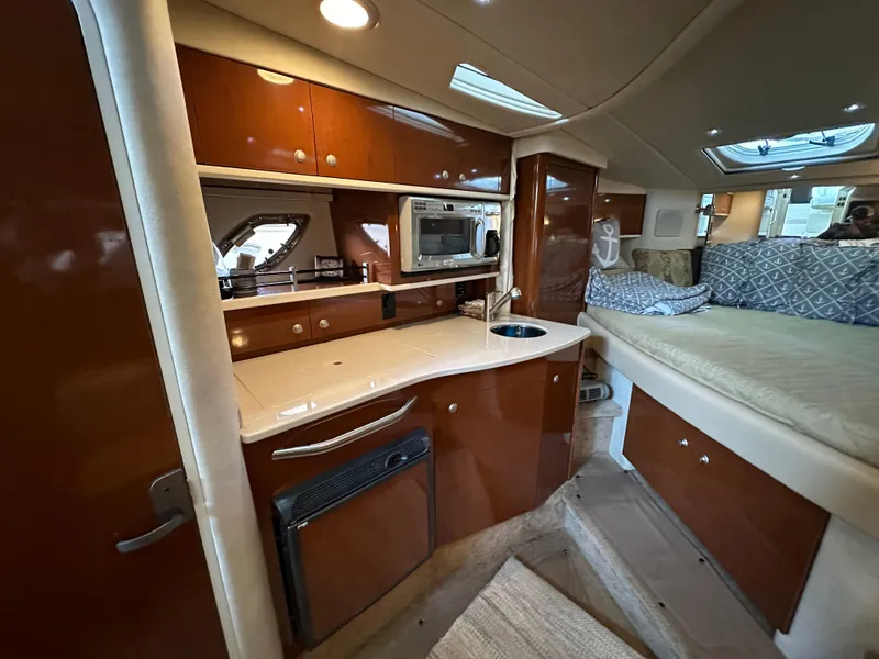 Slide: The Image of Interior of 2008 Sea Ray Sundancer 310 yacht with kitchenette and bed. - 6
