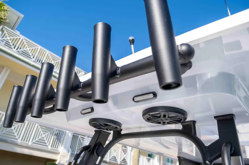 Slide: The Image of Reef Runner 340 boat 2026 with fishing rod holders and speakers. - 13