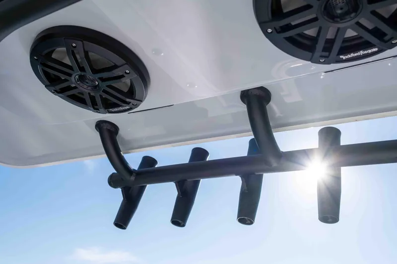 Slide: The Image of Reef Runner 340 2026 speakers and rod holders, sunlight in background. - 14