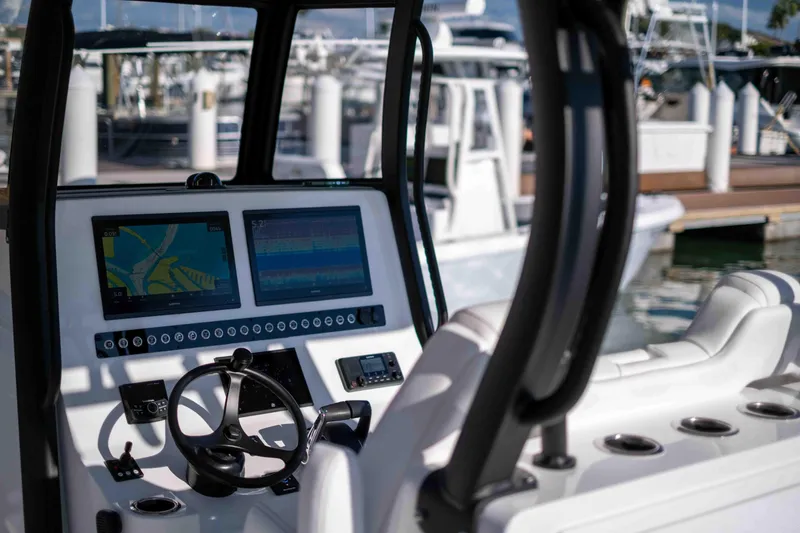 Slide: The Image of Cockpit of Reef Runner 340 boat, model year 2026. - 15