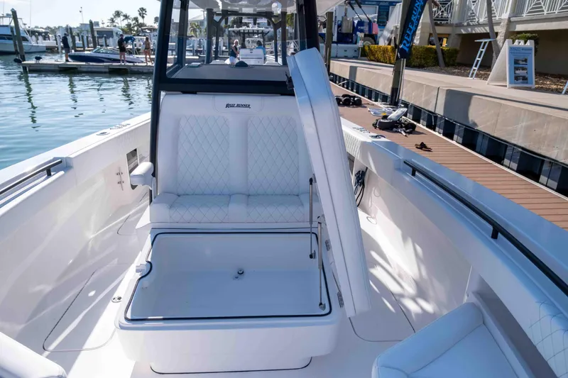 Slide: The Image of Interior view of 2026 Reef Runner 340 boat at the dock. - 17