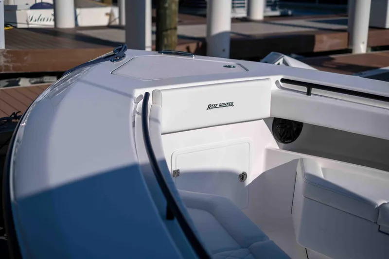 Slide: The Image of Reef Runner 340 boat, 2026 model, docked at marina. - 18