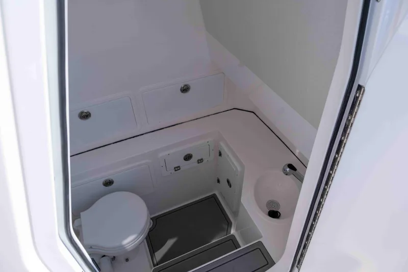 Slide: The Image of Interior of Reef Runner 340 yacht, 2026 model, featuring toilet and sink. - 20
