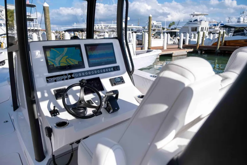 Slide: The Image of Reef Runner 340 boat console with modern navigation, 2026 model. - 8