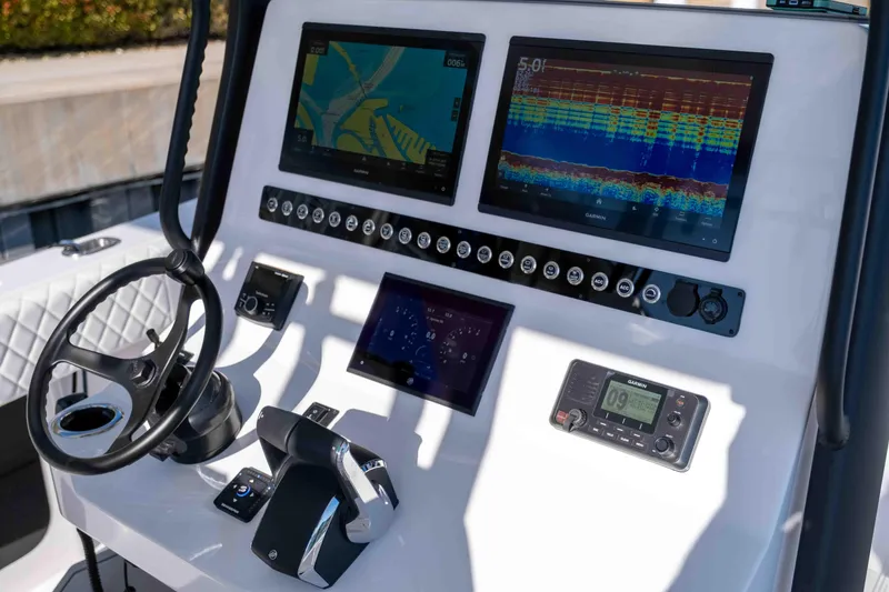 Slide: The Image of Reef Runner 340 2026 boat console with advanced navigation systems. - 9