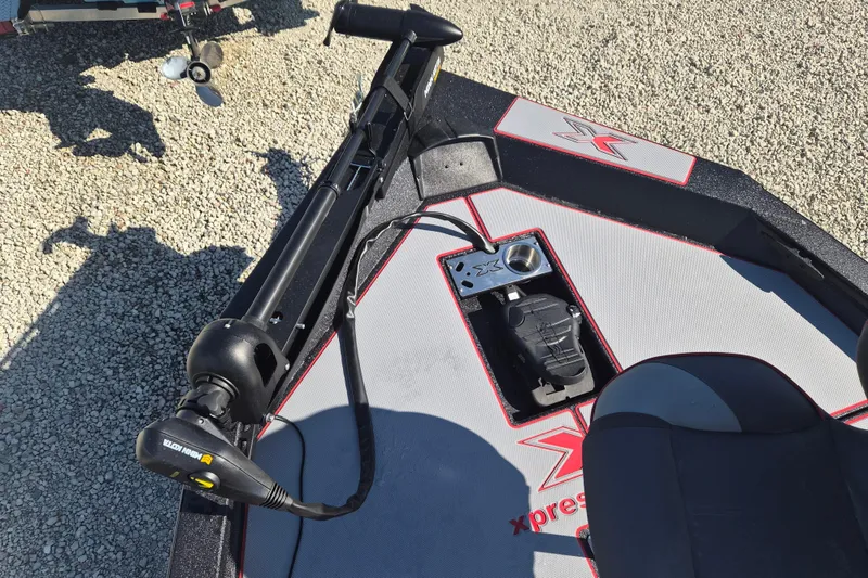 Slide: The Image of 2026 Xpress H20B Bay boat deck with trolling motor and control panel. - 13