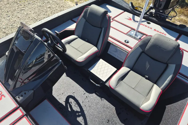 Slide: The Image of 2026 Xpress H20B Bay boat interior with dual seats and steering console. - 5