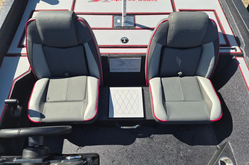 Slide: The Image of Two gray seats on a 2026 Xpress H20B Bay boat deck. - 7