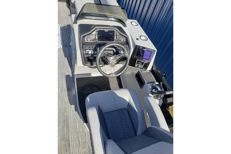 Slide: The Image of Interior view of Bentley Pontoons Legacy 243 Navigator 2026 helm. - 12