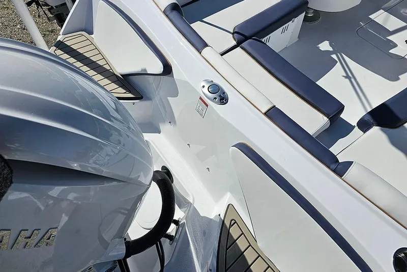 Slide: The Image of 2026 Stingray 20 SBX boat interior with Yamaha engine, featuring sleek seating and modern design. - 10