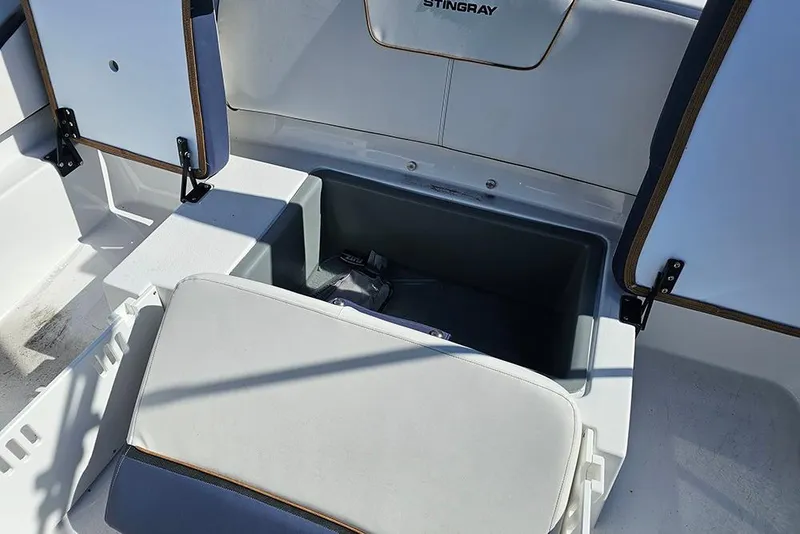 Slide: The Image of 2026 Stingray 20 SBX boat interior with open storage compartments. - 13