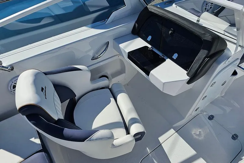 Slide: The Image of 2026 Stingray 20 SBX boat interior with sleek seating and modern dashboard design. - 14