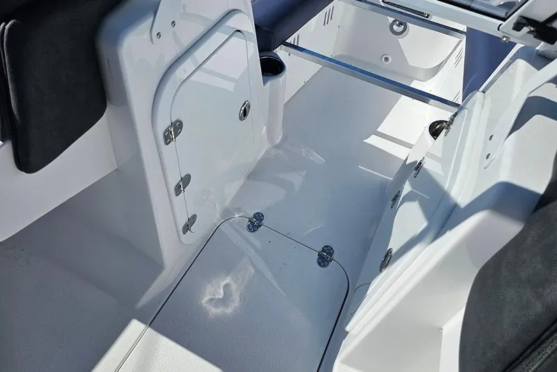 Slide: The Image of Interior view of 2026 Stingray 20 SBX boat, showcasing sleek design and storage compartments. - 21