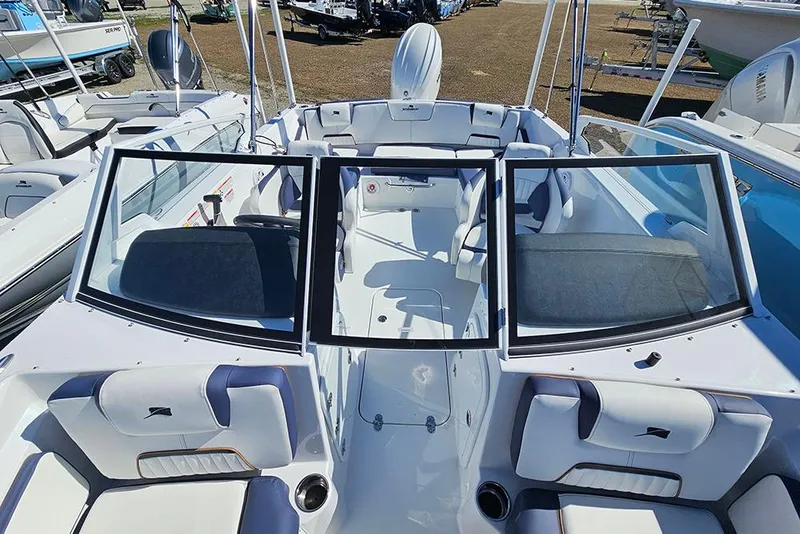 Slide: The Image of 2026 Stingray 20 SBX boat interior with open windshield and seating area. - 26