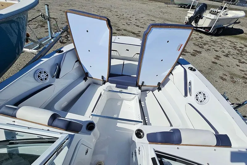 Slide: The Image of 2026 Stingray 20 SBX boat interior with open storage compartments and seating. - 27