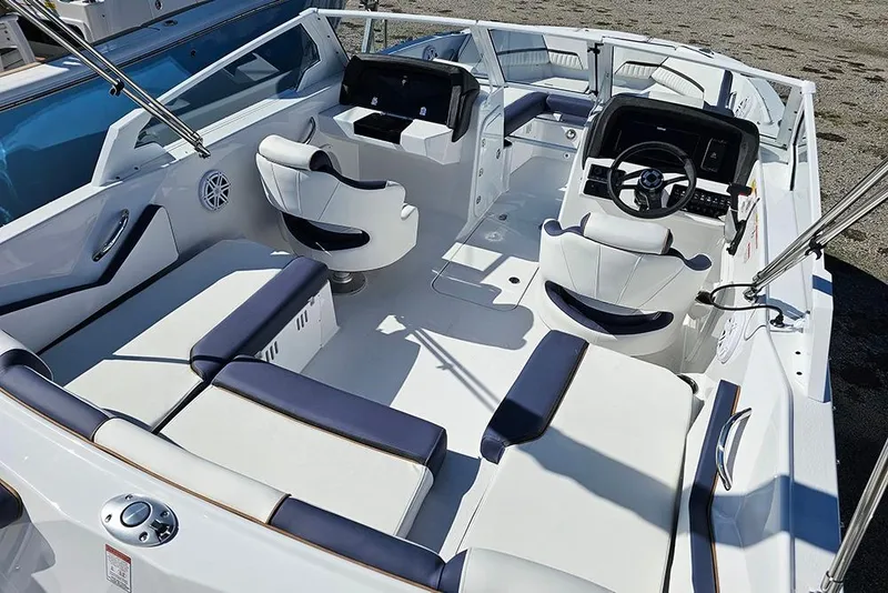 Slide: The Image of 2026 Stingray 20 SBX boat interior with modern seating and steering console. - 9