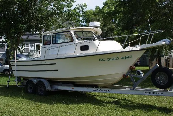 Slide: The Image of Parker Marine 23 Sport Cabin 1994 - 0