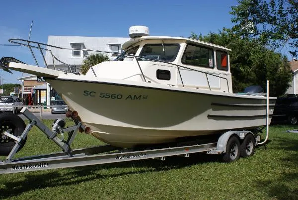 Slide: The Image of Parker Marine 23 Sport Cabin 1994 - 4