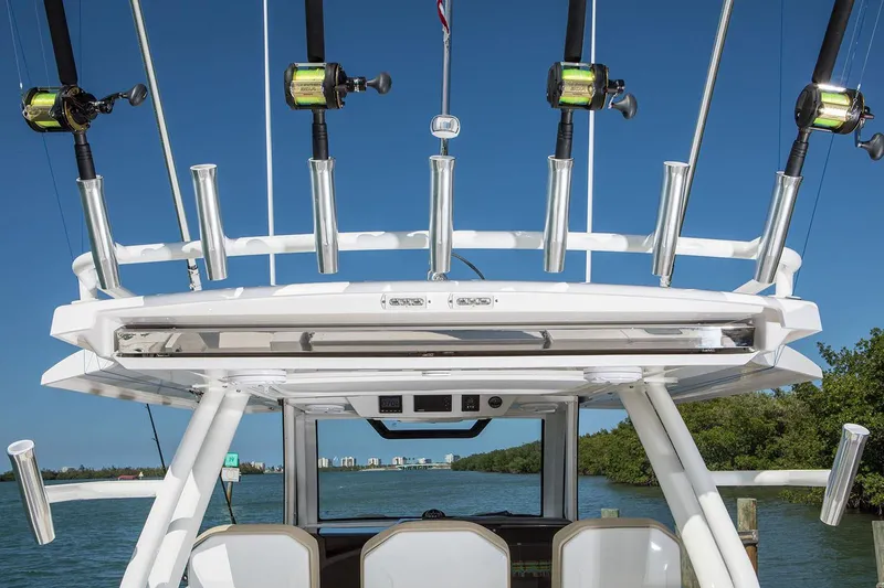 Slide: The Image of Manufacturer Provided Image: 2019 Pursuit S 368 Sport boat with fishing rods and blue sky background. - 12