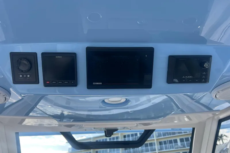 Slide: The Image of 2019 Pursuit S 368 Sport dashboard with Garmin, Yamaha, and JL Audio displays. - 14