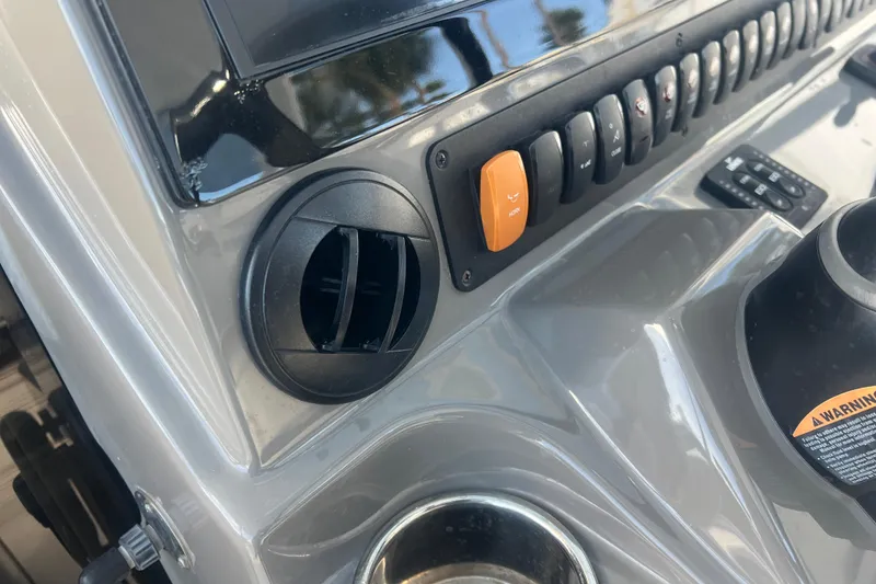 Slide: The Image of Control panel of 2019 Pursuit S 368 Sport boat with switches and air vent. - 16
