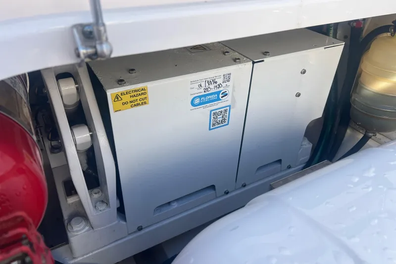 Slide: The Image of Electrical system in 2019 Pursuit S 368 Sport boat, featuring safety warning labels. - 21
