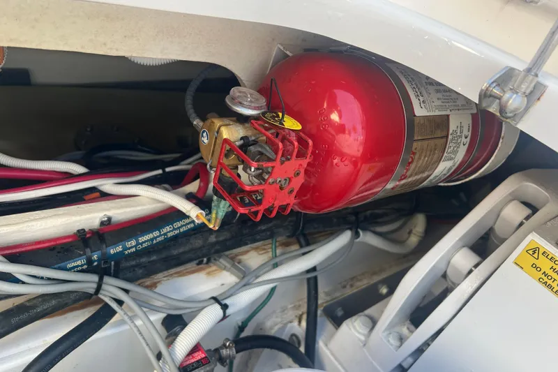Slide: The Image of Fire extinguisher in 2019 Pursuit S 368 Sport boat engine compartment. - 23