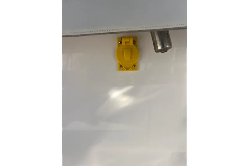 Slide: The Image of Yellow electrical outlet on 2019 Pursuit S 368 Sport boat. - 27