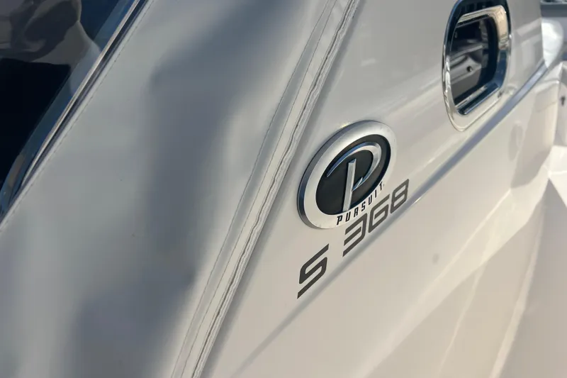 Slide: The Image of 2019 Pursuit S 368 Sport boat emblem and model detail. - 28