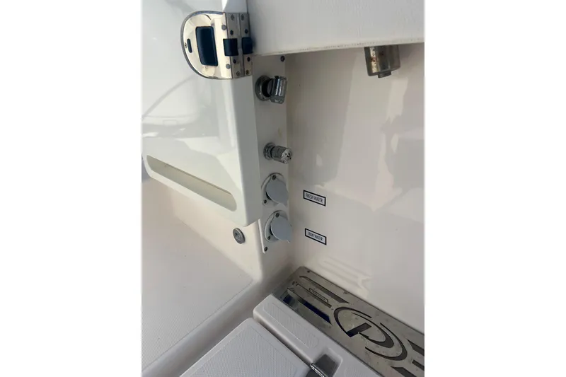 Slide: The Image of 2019 Pursuit S 368 Sport boat interior with fresh and raw water controls. - 29