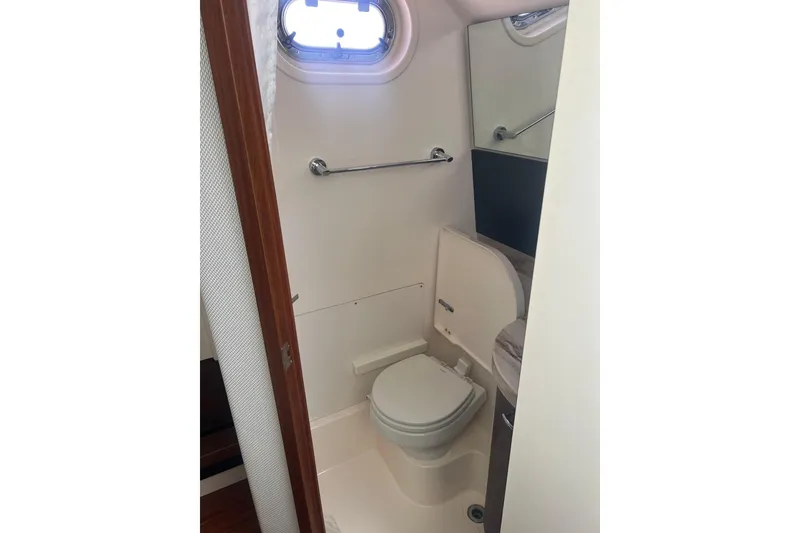 Slide: The Image of Compact bathroom in 2019 Pursuit S 368 Sport boat with toilet and porthole. - 35