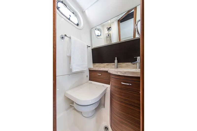 Slide: The Image of Manufacturer Provided Image: 2019 Pursuit S 368 Sport boat bathroom with modern fixtures and wood accents. - 36