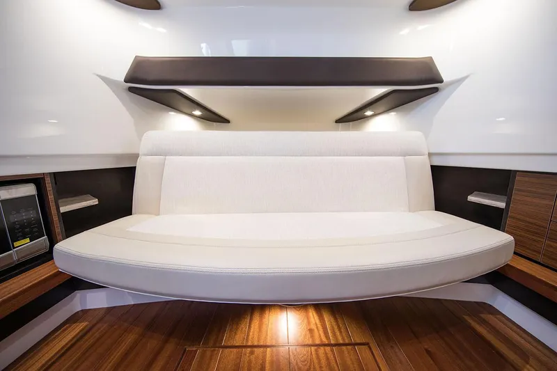 Slide: The Image of Manufacturer Provided Image: Interior seating area of 2019 Pursuit S 368 Sport boat with wooden flooring. - 37